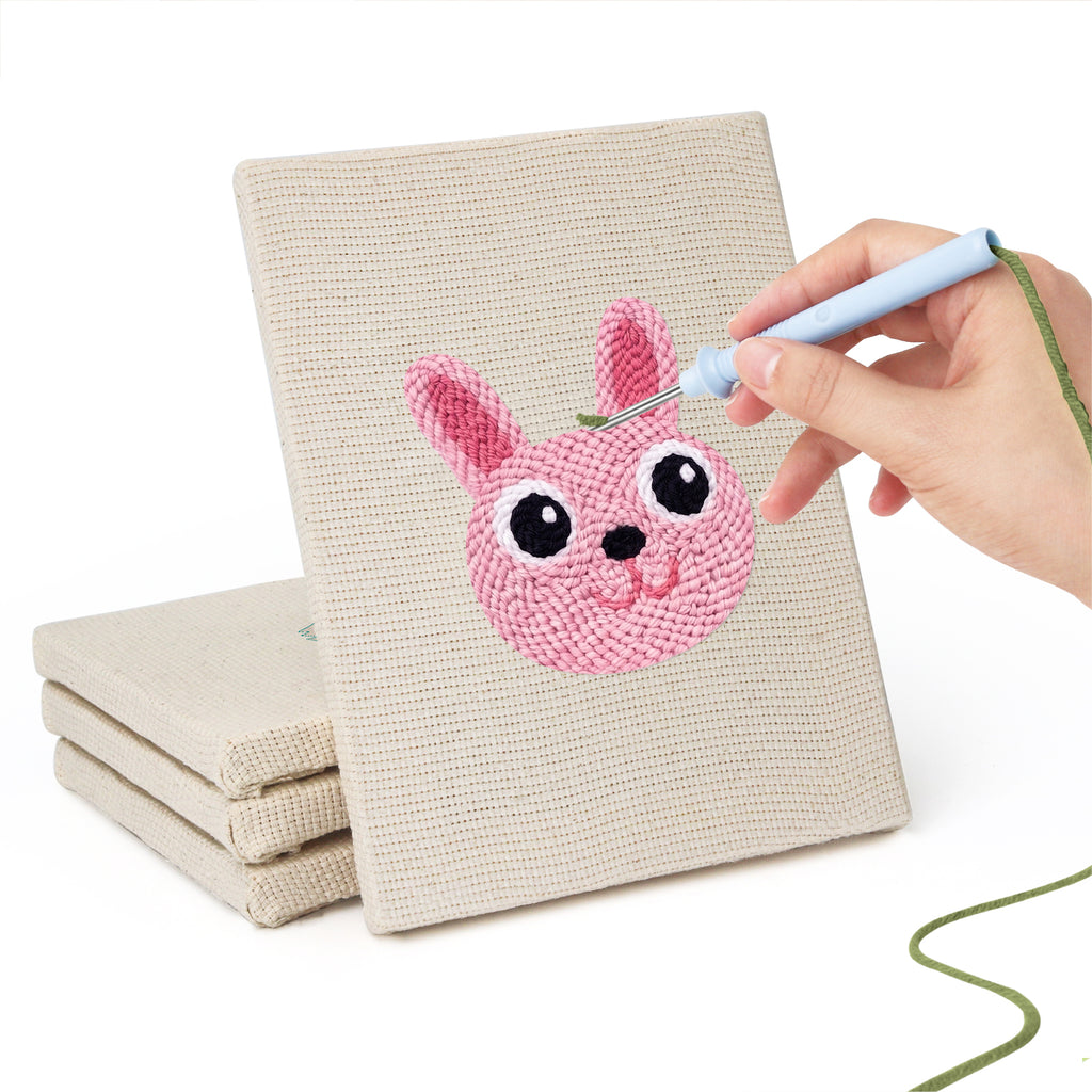 Hand punching one of the Bunny and Hippo mini canvases