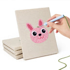Hand punching one of the Bunny and Hippo mini canvases