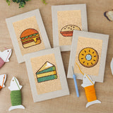 The four finished Burger and Donut mini canvases laid out on a table