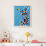 Finished Butterfly Swirl punch needle canvas on a wall