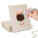 Hand punching one of the Cafe Sweet Treats mini canvases