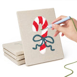 Hand punching one of the Candy Cane Bow mini canvases
