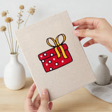 Hand holding a finished Candy Cane Gifts mini canvas
