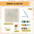 What is in the Candy Corn Cobs kit: printed canvas, punch needle, threader, threads, color guide and hangers