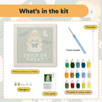What is in the Candy Corn Ghost kit: printed canvas, punch needle, threader, threads, color guide and hangers