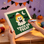 Punching the Candy Corn Ghost design with the punch needle