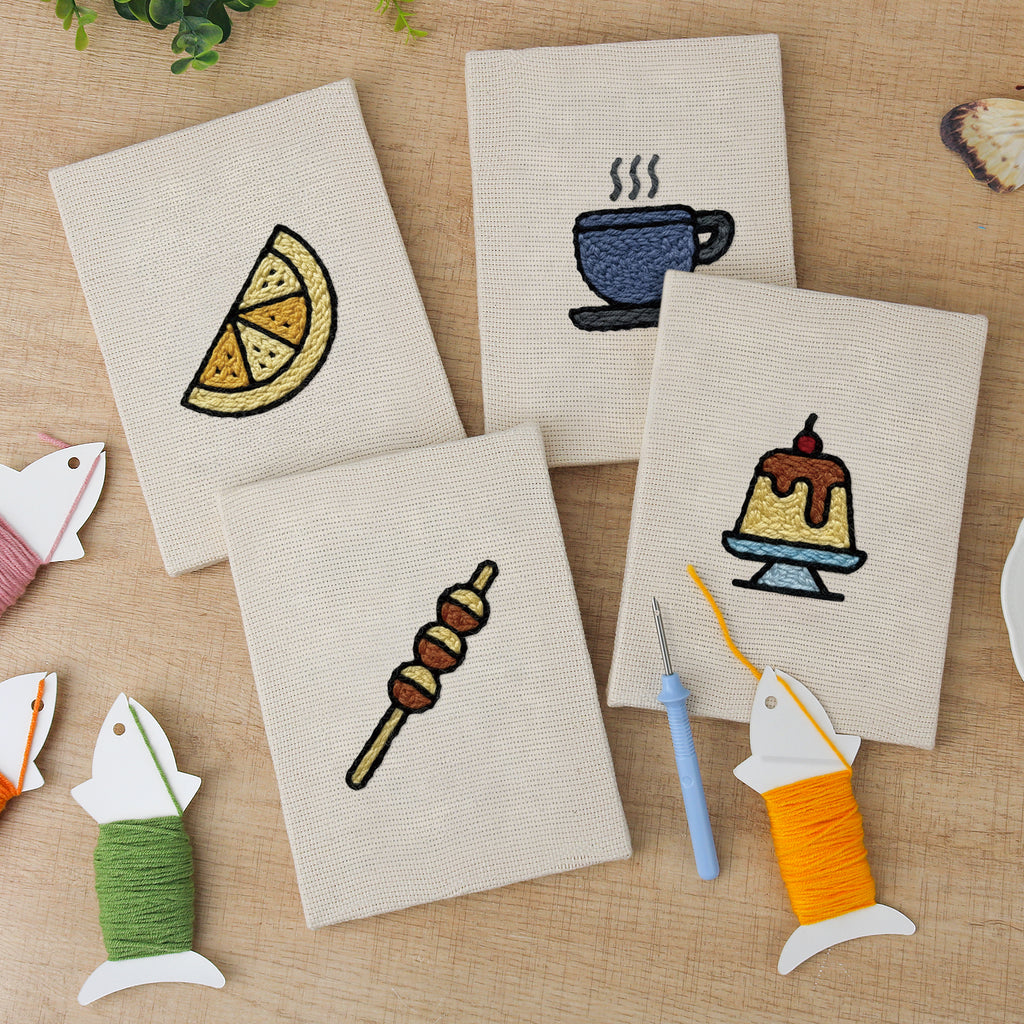 The four finished Caramel Pudding Cafe mini canvases laid out on a table