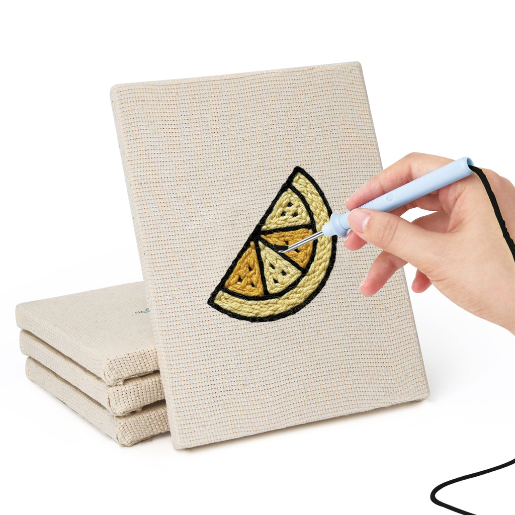 Hand punching one of the Caramel Pudding Cafe mini canvases