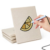 Hand punching one of the Caramel Pudding Cafe mini canvases
