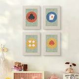 The four Card Suit Circles mini canvases on a wall above a shelf