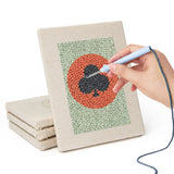 Hand punching one of the Card Suit Circles mini canvases