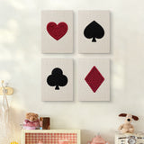 The four Card Suits mini canvases on a wall above a shelf