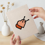 Hand holding a finished Cat and Bat mini canvas