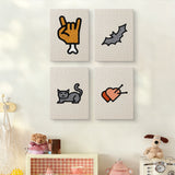 The four Cat and Bat mini canvases on a wall above a shelf