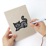 Punching a Cat and Bat mini canvas with the punch needle