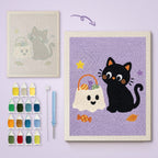 Cat and Ghost Candy Bag canvas before and after punching, with the threads and tools