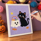 Punching the Cat and Ghost Candy Bag design with the punch needle