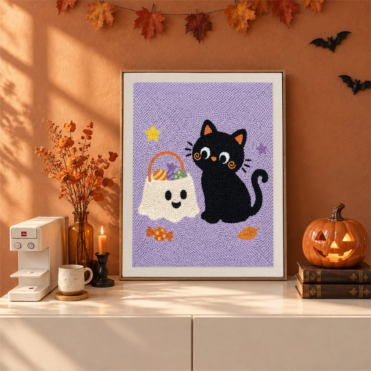 Finished Cat and Ghost Candy Bag punch needle canvas on a wall
