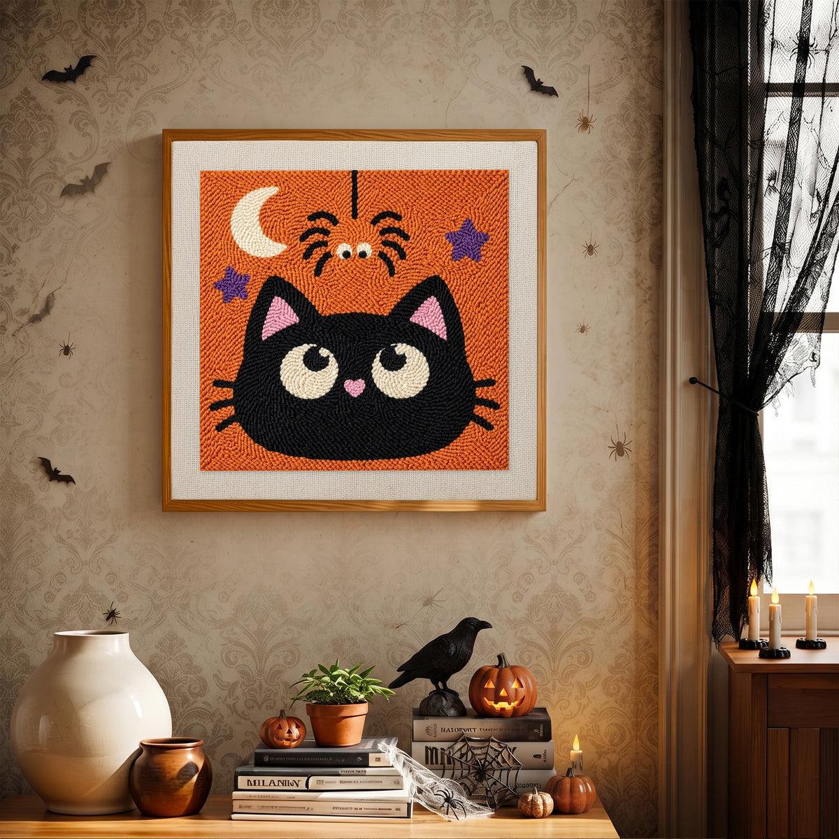 Finished Cat and Spider punch needle canvas on a wall