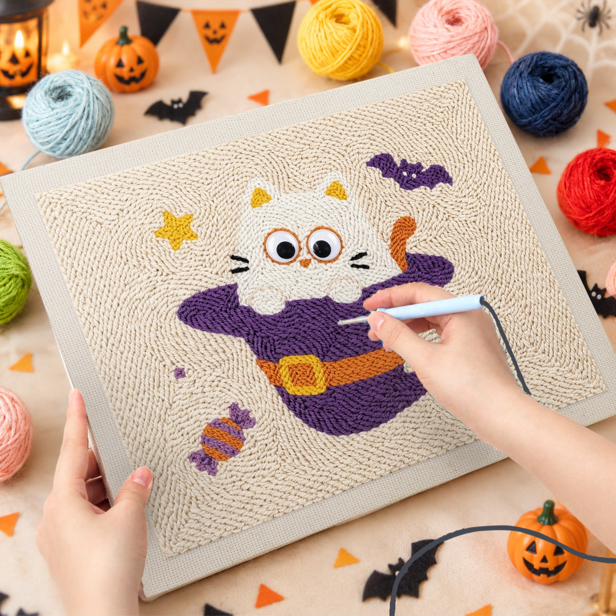 Punching the Cat Ghost in a Witch Hat design with the punch needle