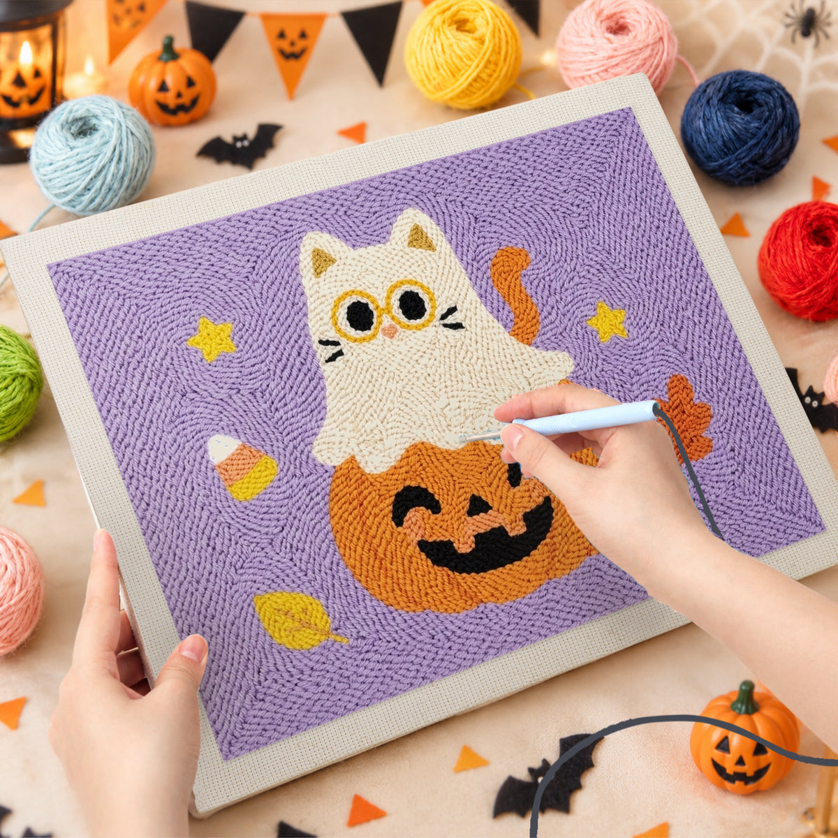 Punching the Cat Ghost on a Pumpkin design with the punch needle
