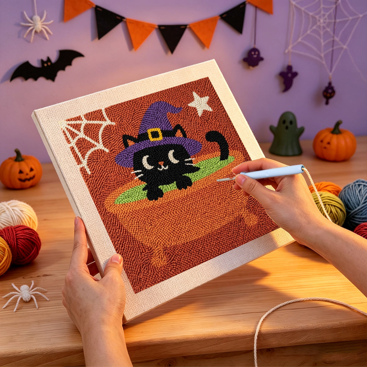 Punching the Cat in a Cauldron Bath design with the punch needle