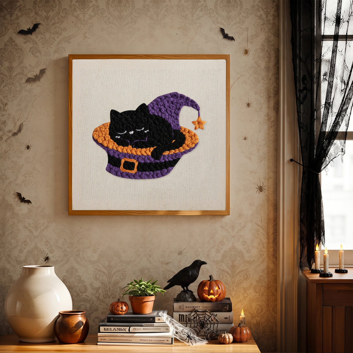 Finished Catnap in a Hat punch needle canvas on a wall