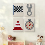 The four Checkered Flag Racing mini canvases on a wall above a shelf