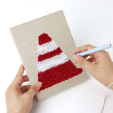 Punching a Checkered Flag Racing mini canvas with the punch needle