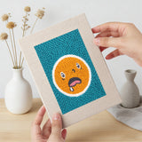 Hand holding a finished Cheeky Face Circles mini canvas