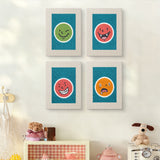The four Cheeky Face Circles mini canvases on a wall above a shelf