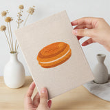 Hand holding a finished Cheese and Pastries mini canvas