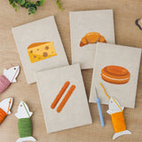 The four finished Cheese and Pastries mini canvases laid out on a table