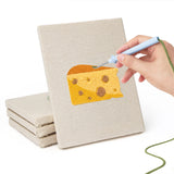 Hand punching one of the Cheese and Pastries mini canvases