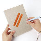 Punching a Cheese and Pastries mini canvas with the punch needle