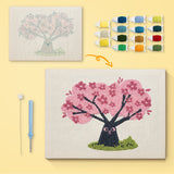 Cherry Blossom Tree canvas before and after punching, with the threads and tools