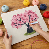 Punching the Cherry Blossom Tree design with the punch needle