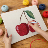 Punching the Cherry Pair design with the punch needle