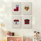 The four Christmas Morning mini canvases on a wall above a shelf
