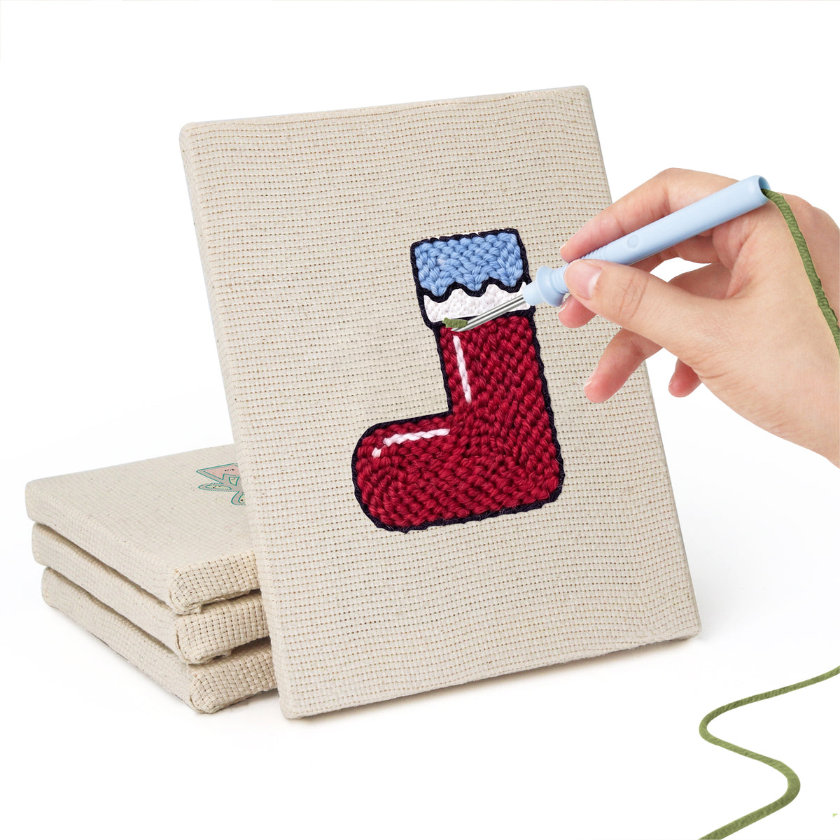 Hand punching one of the Christmas Morning mini canvases