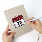 Punching a Christmas Morning mini canvas with the punch needle