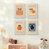The four Citrus and Blackberries mini canvases on a wall above a shelf