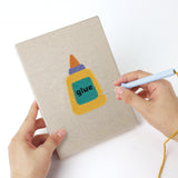 Punching a Classroom Globe mini canvas with the punch needle