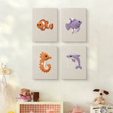 The four Clownfish Reef mini canvases on a wall above a shelf
