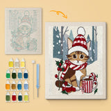 Cocoa Christmas Cat canvas before and after punching, with the threads and tools