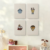 The four Coconut Crepe Cafe mini canvases on a wall above a shelf