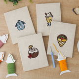 The four finished Coconut Crepe Cafe mini canvases laid out on a table