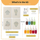 What is in the Coconut Crepe Cafe set, 8 × 12 in (20 × 30 cm) each: 4 printed canvases, punch needle, threader, threads, color guide and 4 sets of hangers