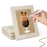 Hand punching one of the Coffee Shop Cups mini canvases