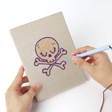 Punching a Coffin and Gravestone mini canvas with the punch needle